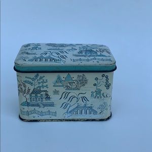 small tin box with hinged lid